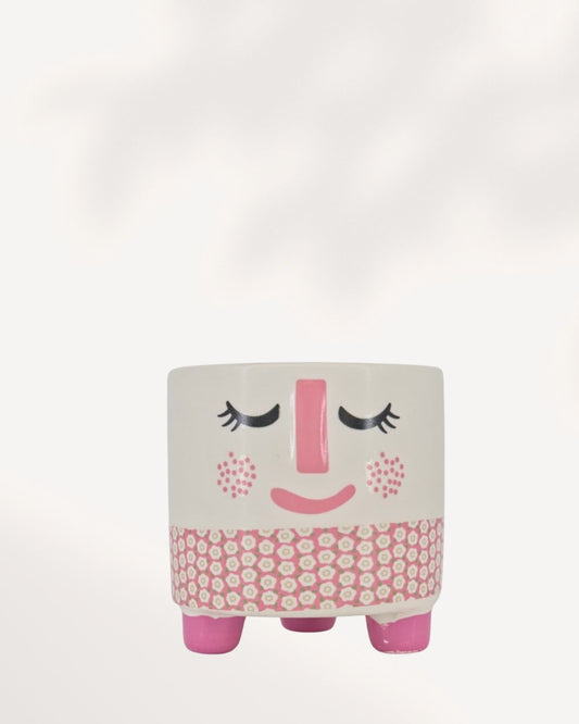 Small ceramic and clay Rosie Pot featuring a white, rosy pink, and charcoal accent color palette.